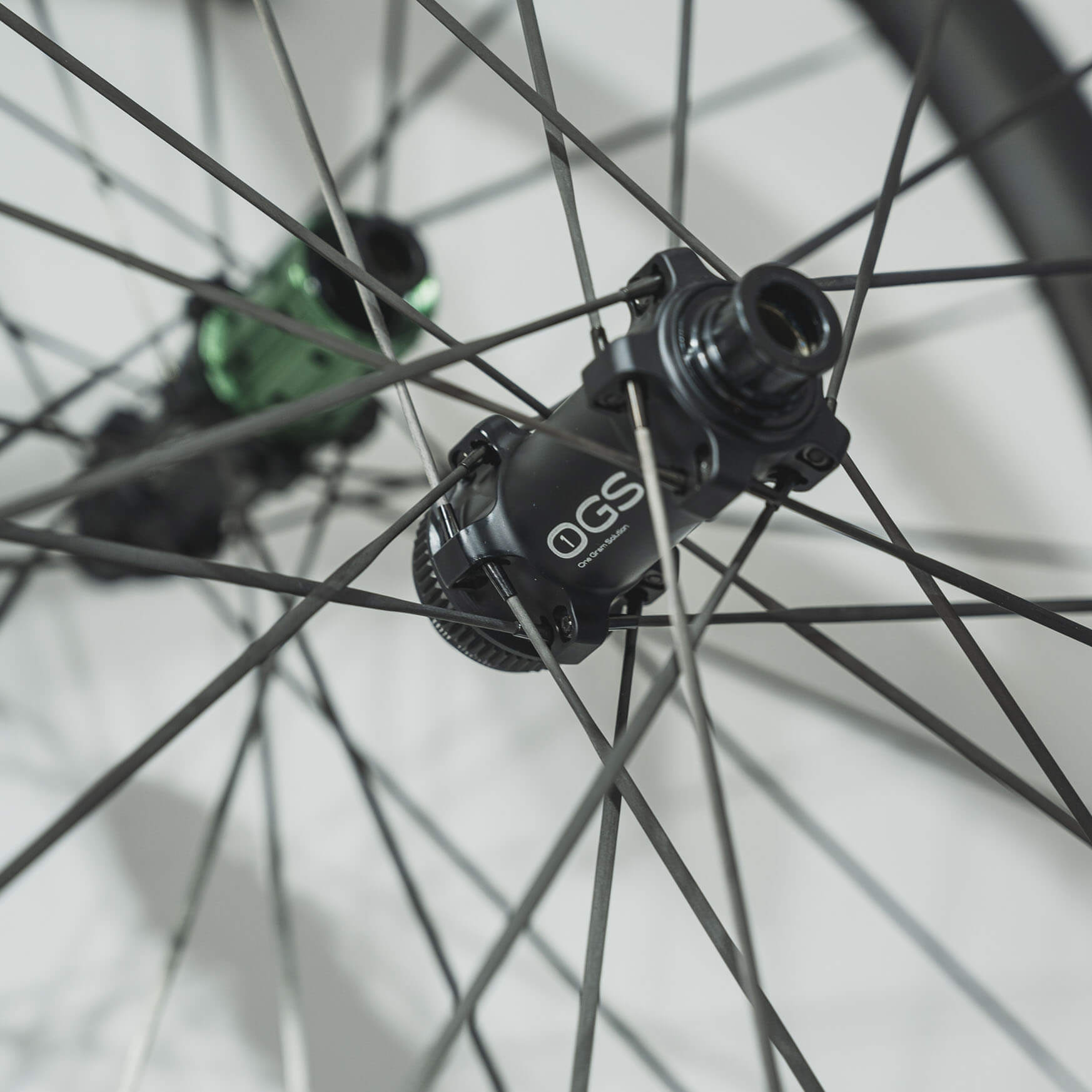 First hub laced up, spokes fall inside special T-shaped slots in the hub's flange.