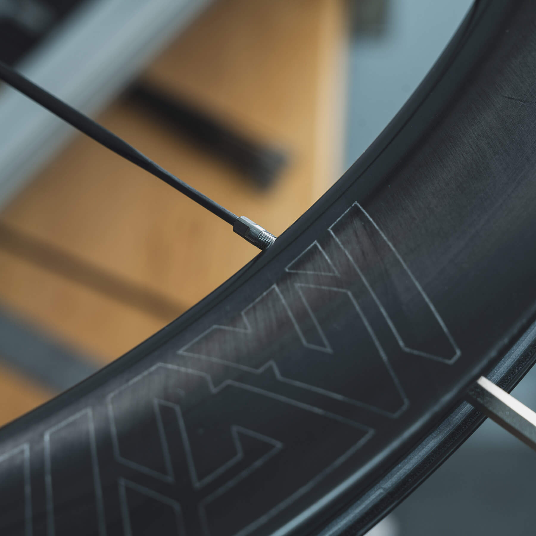 The lacing phase of a carbon spoke wheelset.